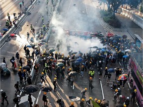 Demonstrators disperse after a tear gas is fired by Hong Kong police in Hardcourt Road, Admiralty, in Hong Kong, China, August 5, 2019. REUTERS/Eloisa Lopez ORG XMIT: GGGEALO2