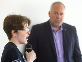 Elsbeth Dodman of London, who is autistic asks Todd Smith, the Minister of Children, Community and Social Services when she could expect help from the government since she has aged out of all the programs for autism. Smith was in London on Tuesday for a meet and greet with autism families. (Mike Hensen/The London Free Press)