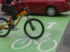 Bikes and cars on the new O'Connor Street bike lane in Ottawa Thursday Oct. 27, 2016.