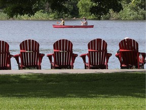 A row of deck chairs on one side of Dow's Lake.