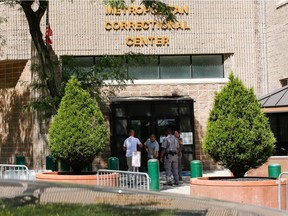 Security personnel and people are seen at the entrance of the Metropolitan Correctional Center jail where financier Jeffrey Epstein was found dead in the Manhattan borough of New York City, New York, U.S., August 12, 2019. REUTERS/Eduardo Munoz ORG XMIT: EMZ7051