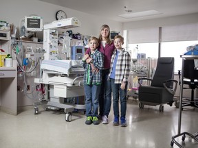 Liam and Rhys White with their mother Nora Shipton in the NICU where they spent the first two and a half months of their lives.