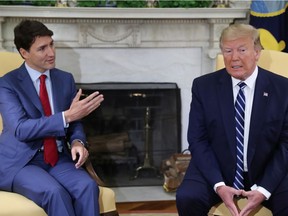 File photo/ Canada's Prime Minister Justin Trudeau speaks as he meets with U.S. President Donald Trump in the Oval Office of the White House in Washington, U.S., June 20, 2019.