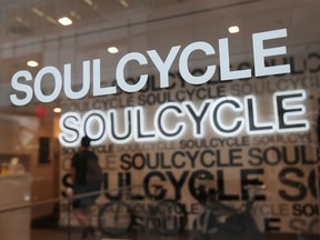 The sign for SoulCycle is seen at the entrance to the fitness chain in New York City, U.S., August 8, 2019.