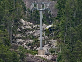 A gondola car rests on its side on the mountain after a cable snapped overnight at the Sea to Sky Gondola causing cable cars to crash to the ground below in Squamish, B.C., on Saturday, August 10, 2019. No injuries were reported and the gondola has been closed by operators for the foreseeable future.