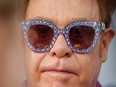 Elton John wrote that he felt it was his duty to "protect" the young family from the media given his closeness with Diana and accused the press of contributing to her "untimely death."