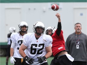 #62 Nolan MacMillan  and #9 Brandon Bialkowski practice during the opening day for the Redblacks rookies training camp. May 28, 2014.