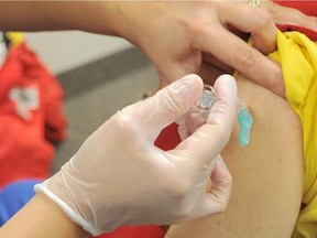 A flu shot is administered at Lambton Public Health.