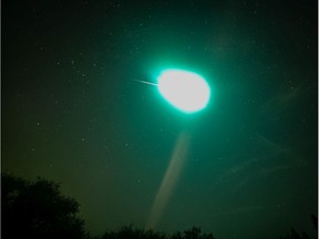 A suspected meteor lights up the night sky above Elk Island National Park on Saturday night. (Photo by Kyle Chuback).