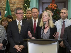 Ottawa Centre MP Catherine McKenna, alongside Ottawa Mayor Jim Watson (L) and Ottawa South MP David McGuinty, speaks about the Sir John Carling site for the construction of the new Civic campus of the Ottawa Hospital in 2016. She had at first endorsed Tunney's Pasture for the hospital site.