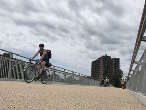 Bikers and pedestrians share a new route over the Rideau Canal now that the Flora Footbridge has officially opened. But to some, it's a dangerous combination.