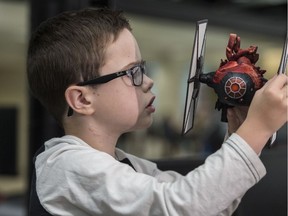 Mason Thomas, 8, was  presented with a 3-D model of his heart that was 3D printed in the form of a Tie Fighter from Star Wars--a special request from the young Star Wars fan on September 11, 2019 at the University of Alberta.