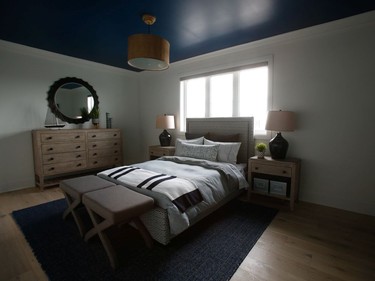 The boy's room 'feels a little more masculine than some of the other rooms,' says Collins, who brought in wood accents and a painted ceiling. Like all the bedrooms, it has a walk-in closet, but this room also includes its own ensuite.