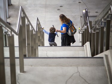 A historic day in the capital Saturday as the public finally got to ride the LRT system. A young child takes time on the Hurdman Station stairs.   Ashley Fraser/Postmedia