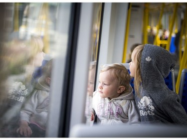 Day two of the light-rail transit had commuters and the general public out checking out the LRT system Sunday September 15, 2019. Two-year-old Annika Anderson and her big sister four-year-old Elerie Anderson watch out the window as they took a ride on the train with her family.