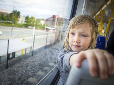 Day two of the light-rail transit had commuters and the general public out checking out the LRT system Sunday September 15, 2019. Four-year-old Elerie Anderson watches out the window of the train Sunday morning.