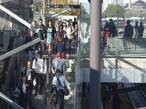 Commuters use the Tunney's Pasture LRT station on Monday, the first rush-hour test of the new system. Patrick Doyle/Ottawa Citizen