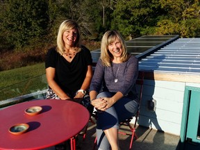 Writer Dianne Daniel, right, relaxes on the deck.