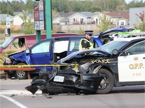 OPP officer at three-vehicle collision involving two OPP cruisers on Petawawa Blvd. in front of the Petawawa Market Mall Wednesday.