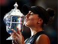 Bianca Andreescu kisses the championship trophy after defeating Serena Williams in the U.S. Open women's singles final on Saturday.