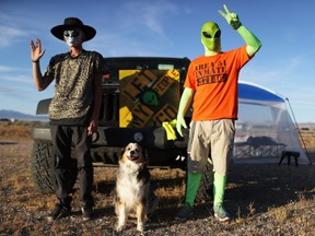 Revelers pose at the 'Storm Area 51' spinoff event 'Alienstock' on September 20, 2019 in Rachel, Nevada.