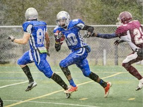 File photo showing Patrice Rene (#10) when he played for St. Peter in a game against Sir Wilfrid Laurier  in AAA/AAAA High School Football.