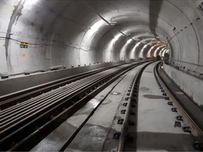 A photo taken during the LRT construction process shows trackwork in the tunnel between Parliament and Rideau station.