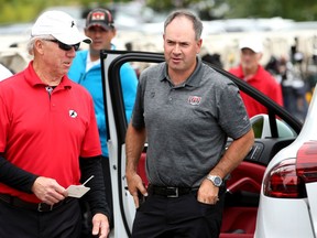 Sens GM Pierre Dorion (centre) arrives at the event. Ottawa Senators players and staff took to the Marshes Golf Club Tuesday for the Annual Bell Senators Charity Golf Classic, where foursomes are rounded out with players to raise money for the Sens Foundation.