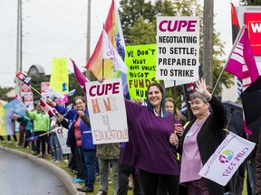 Education workers protest in front of the Ottawa Catholic School Board earlier this week.