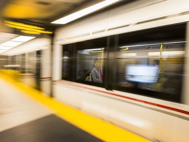 A woman looks out the window as the train pulls into the Lyon Station as the LRT officially opens on September 14, 2019 complete with ceremonies at Tunney's Pasture.