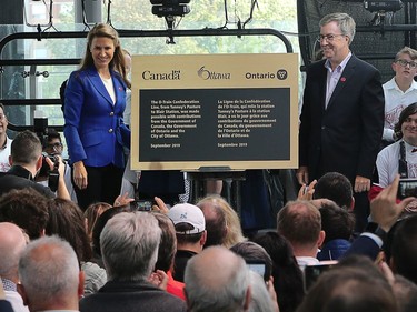 Caroline Mulroney, Ontario Minister of Transportation and Mayor Jim Watson unveil the official plaque as the LRT officially opens with ceremonies at Tunney's Pasture.
