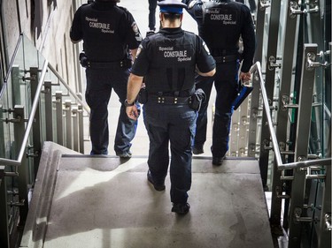 OC Transpo Special Constable agents walk through Lees Station on Saturday.