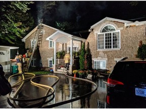 Ottawa Fire Services crews on the scene of a fire at 3030 Innes Rd. on Thursday night.