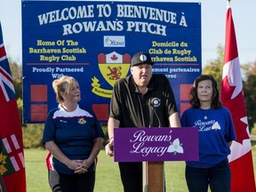 Lisa MacLeod, MPP for Nepean and Minister of Tourism, Culture and Sport (L), and Kathleen Stringer (R), listen as Gordon Stringer speaks of their daughter Rowan Stringer who died in 2013 from concussion related injuries.