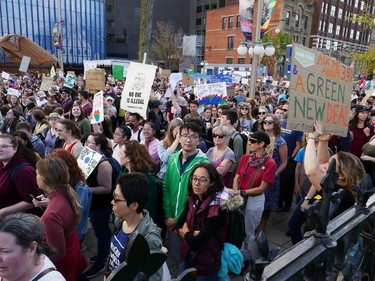 A large group heads towards Parliament Hill as the Global Climate Protest took to the streets of Ottawa on Friday afternoon.