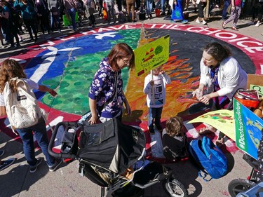A massive painting of the earth on fire in Confederation Park as the Global Climate Protest took to the streets of Ottawa on Friday afternoon.