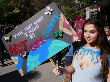 Harriet Fischer with her sign in Confederation Park as the Global Climate Protest took to the streets of Ottawa on Friday afternoon