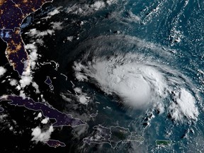 This satellite image obtained from NOAA/RAMMB, shows Hurricane Dorian as it approaches the Bahamas and Florida at 11:20UTC on Friday.