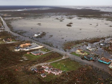 A handout aerial photograph released by the UK Ministry of Defence (MOD) on September 4, 2019 shows debris and destruction in the aftermath of Hurricane Dorian on the island Great Abaco in the northern Bahamas on September 3, 2019 during a reconnaissance mission launched by personnel onboard RFA Mounts Bay. - Bahamian, US and British teams ramped up rescue efforts on Wednesday for survivors of Hurricane Dorian, which caused widespread devastation as it pounded the Atlantic archipelago.