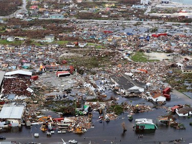 A handout aerial photograph released by the UK Ministry of Defence (MOD) on September 4, 2019 shows debris and destruction in the aftermath of Hurricane Dorian on the island Great Abaco in the northern Bahamas on September 3, 2019 during a reconnaissance mission launched by personnel onboard RFA Mounts Bay. - Bahamian, US and British teams ramped up rescue efforts on Wednesday for survivors of Hurricane Dorian, which caused widespread devastation as it pounded the Atlantic archipelago.