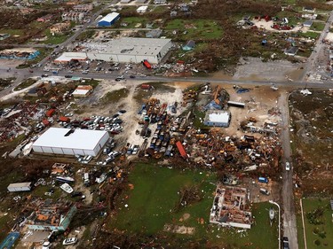 A handout aerial photograph released by the UK Ministry of Defence (MOD) on September 4, 2019 shows debris and destruction in the aftermath of Hurricane Dorian on the island Great Abaco in the northern Bahamas on September 3, 2019 during a reconnaissance mission launched by personnel onboard RFA Mounts Bay. - Bahamian, US and British teams ramped up rescue efforts on Wednesday for survivors of Hurricane Dorian, which caused widespread devastation as it pounded the Atlantic archipelago.