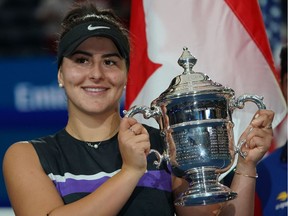 Bianca Andreescu poses with the trophy after defeating Serena Williams in the final at the 2019 U.S. Open at the USTA Billie Jean King National Tennis Center in New York on Sept. 7, 2019.