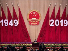 China's President Xi Jinping delivers a speech at a reception to celebrate the 70th anniversary of the founding of the People's Republic of China at the Great Hall of the People in Beijing on September 30, 2019.