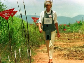 FILE PHOTO: Diana, Princess of Wales is seen in this January 15 1997 file picture walking in one of the safety corridors of the land mine fields of Huambo, Angola during her visit to help a Red Cross campaign to outlaw landmines worldwide.