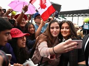 U.S. Open tennis champion Bianca Andreescu poses for selfies with fans gathered at the "She The North" celebration rally in her honour in Mississauga on Sunday.