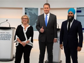 Conservative leader Andrew Scheer, shown here with the Greens' Elizabeth May and New Democratic Party (NDP) leader Jagmeet Singh at last week's debate, pledges to stay out of the brouhaha over Quebec's Bill 21.