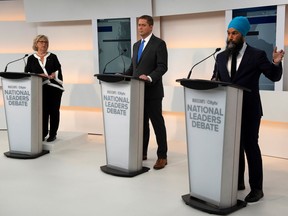 Green Leader Elizabeth May, Conservative Leader Andrew Scheer and New Democratic Party Leader Jagmeet Singh take part in the Maclean's/Citytv National Leaders Debate on the second day of the election campaign in Toronto on Thursday, Sept. 12, 2019.