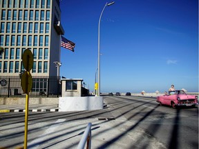 Tourists in a vintage car pass by the U.S. Embassy in Havana last November.