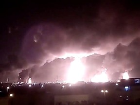 Fires burn in the distance after a drone strike by Yemen's Iran-aligned Houthi group on Saudi company Aramco's oil processing facilities, in Buqayq, Saudi Arabia, Sept. 14, 2019.