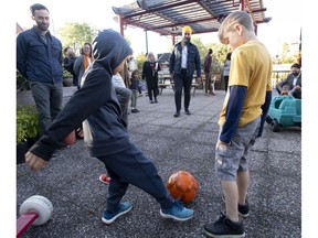 NDP leader Jagmeet Singh plays soccer with boys during a campaign stop in Ottawa on Tuesday Sept. 17, 2019.